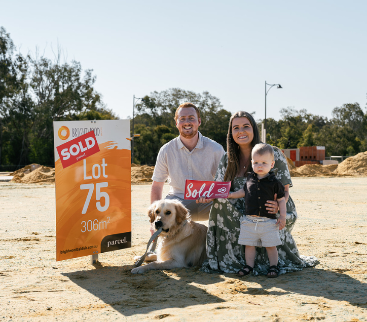 how to build a home on a budget
family in front of sale sign with dog 